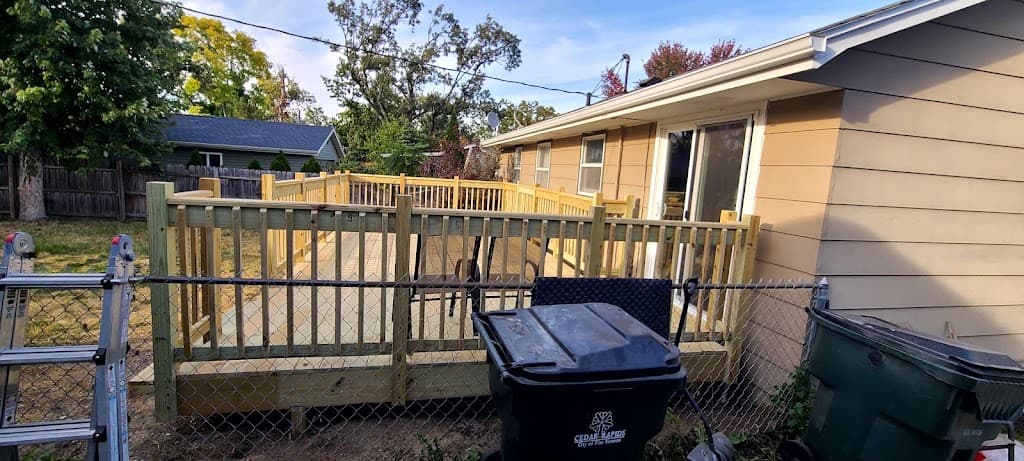 New deck framing being built around an above-ground pool